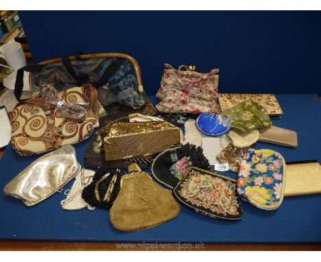 A quantity of bags and purses including embroidered and tapestry evening bags etc.