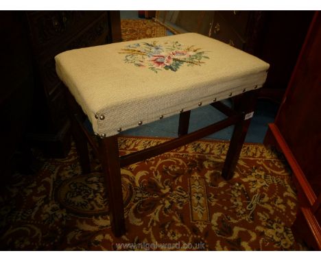 A darkwood framed Dressing Stool having a tapestry upholstered seat depicting a stylised spray of flowers, 20'' x 13 1/2'' x 