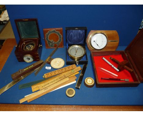 A quantity of miscellanea including surveying items, barometer with nautical compass, angle measuring units, brass aneroid ba