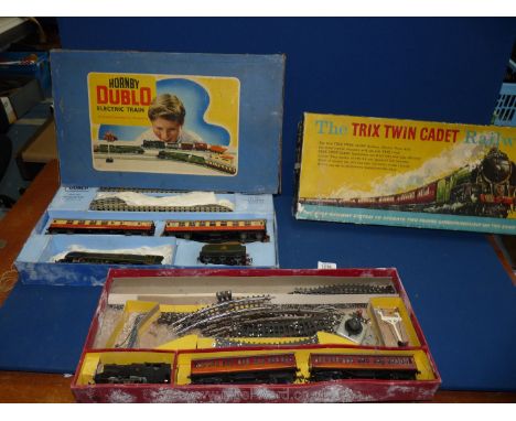 A boxed Hornby Dublo electric train set with the Duchess of Montrose engine, a/f. and 'The Trix Twin Cadet Railway' set, also