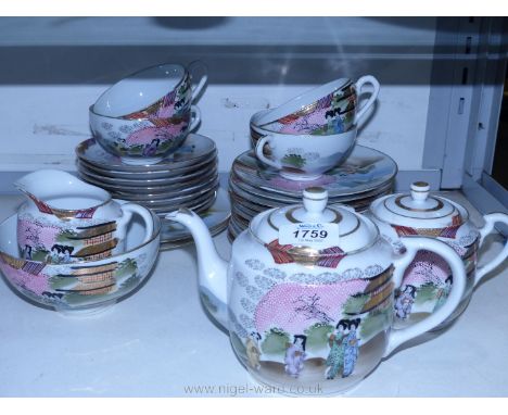 A part Japanese Teaset with hand-painted decoration of blossom tree with two ladies to include a teapot, four cups, nine sauc