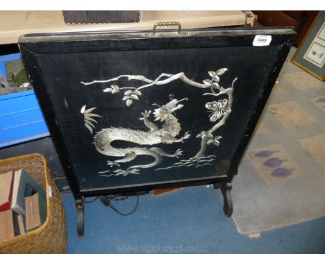 A silk embroidered firescreen of a dragon under a tree, 29" x 23" wide.