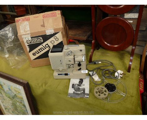 A boxed Eumig P8 projector.