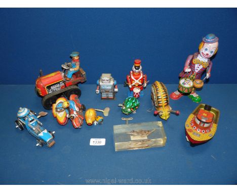 A box of wind-up Toys including farmer on tractor, clowns, frog (working), etc.