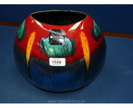 A Poole Pottery vase, oval shaped in blue, yellow, red and green, 10 1/2" tall.