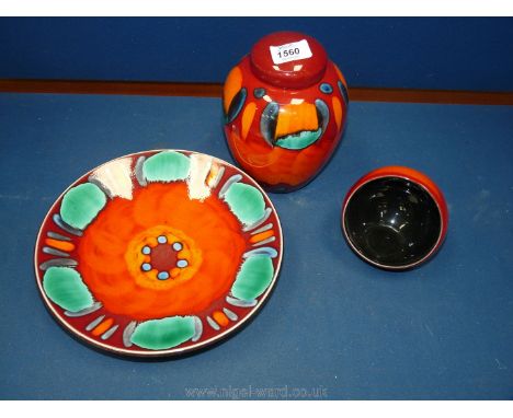 Three pieces of Poole Pottery including 'Volcano' ginger jar and dish and 'African Sunset' nut bowl.