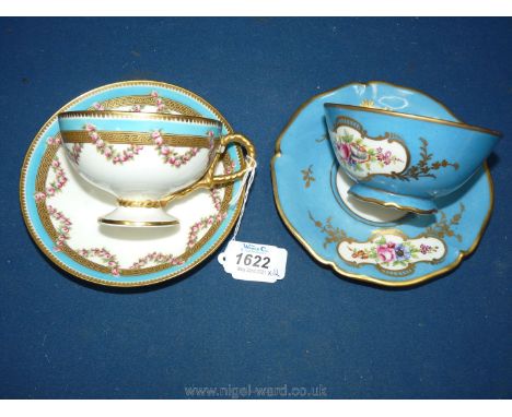 A Victorian porcelain cabinet cup and saucer decorated with garlands of flowers within blue borders, kite registration for 18