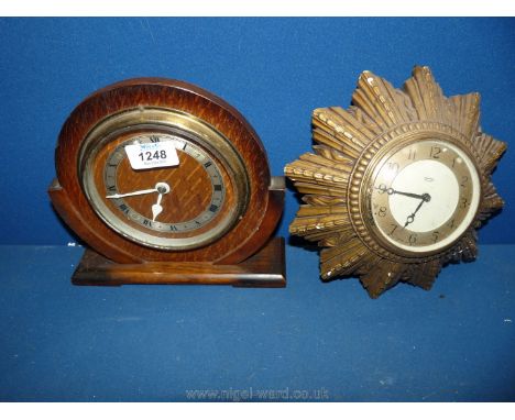 A Smiths eight day sunray wall clock and a wooden faced mantle clock.