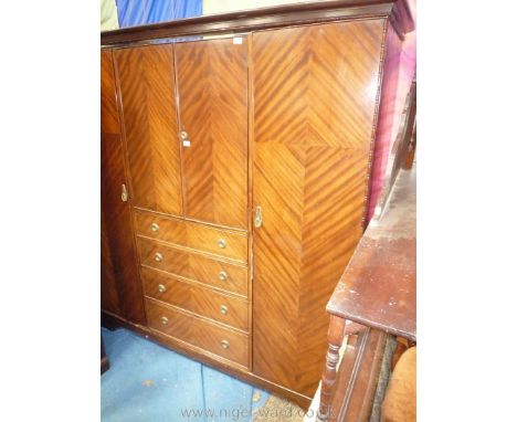 A herringbone Mahogany finished Double Wardrobe having an oak back and with a central upper cupboard with hanging space and t