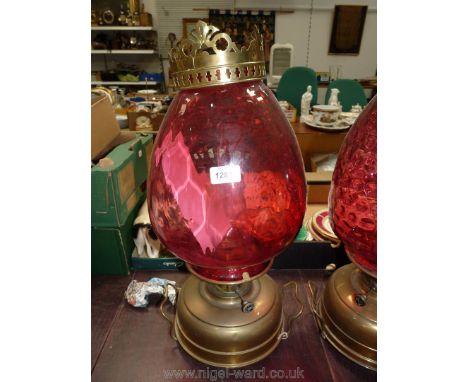 A Victorian church Oil/heater Lamp with squat brass fount standing on three squat feet, complete with handles and having a tu