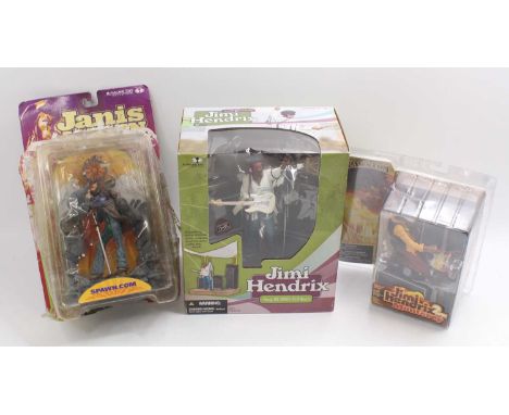 Mcfarlane Toys group of three to include a 2004 issue Jimi Hendrix figure, a Spawn.com Jimi Hendrix figure and a Janas Joplin