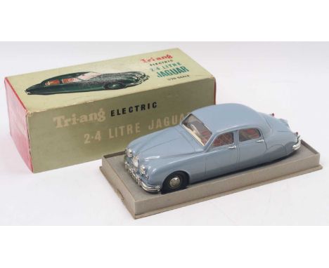 Tri-Ang Minic 1/20 scale Battery Operated plastic model of a No.M004 Jaguar 2.4 Litre in light blue body with chequered seats