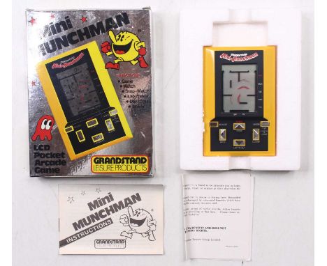 GrandStand Products LCD Pocket Arcade Game of Mini-Munchman housed in a polystyrene packed pictorial card box with instructio