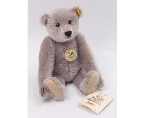 A Steiff 1905 modern release Classic Richard Steiff bear, light grey mohair example, with yellow tag No. 001666, height 30cm