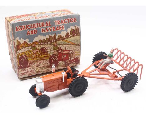 Crescent Toys no.1802 Agricultural Tractor and Hayrake boxed set, comprising orange rake with black wheels, tractor, in orang