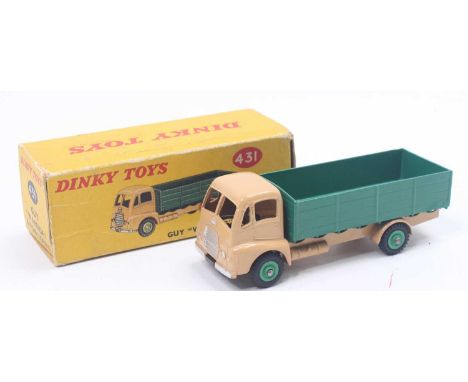 Dinky Toys No. 431 Guy Warrior 4-ton lorry comprising a tan cab, dark green back, and mid-green hubs, no windows fitted. a sl