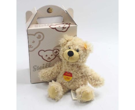 A Steiff Charly Bear No. 012815, soft plush stuffed cream example with yellow ear tag and chest tag, housed in a size 2 Steif