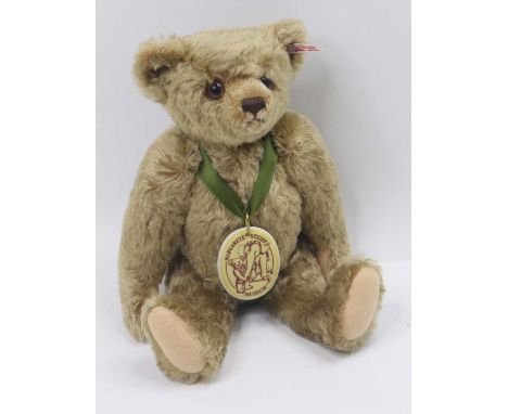 A Steiff Maragarete Steiff Museum 2003 bear, white tag No. 671456, brass mohair complete with silk ribbon and ceramic tag, he