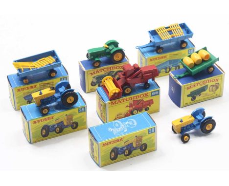 Seven Matchbox Lesney farming-related vehicles to include two no.39 Ford tractors, two no.40 hay trailers, a no.65 Claas comb