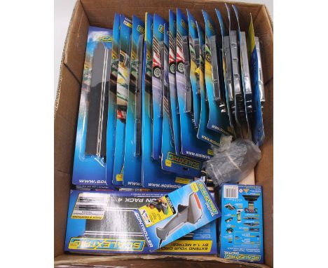 A large box containing a quantity of boxed and unused Scalextric slot racing equipment to include various side swipe straight