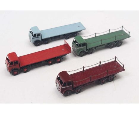 One tray containing four various repainted or play worn Dinky Toy Foden 8-wheel wagons to include a No. 505 flat truck with c
