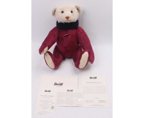A Steiff Dolly teddy bear, white tag No. 038990, limited edition with certificate No. 00129/1500 released, violet/plum with c