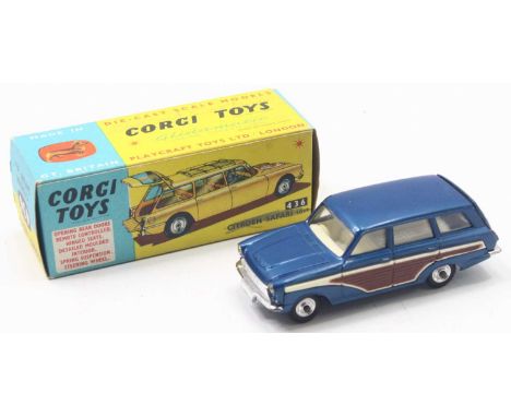 A Corgi Toys 440 Ford Consul Cortina Super Estate in metallic dark blue body, white interior, brown side panels, in an incorr