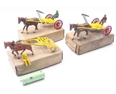 Two Charbens Horse and grass cutter sets, comprising a yellow grass cutter, with red wheels, a driver, and a horse, one in ne