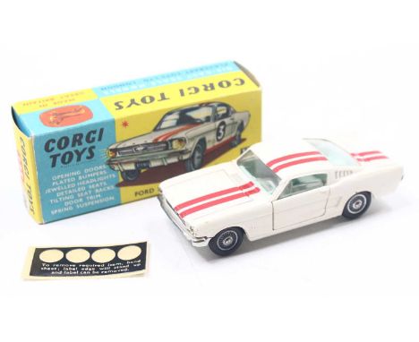 Corgi Toys No. 325 Ford Mustang Fastback 2+2 competition model, comprising of white body with red twin racing stripe, light b