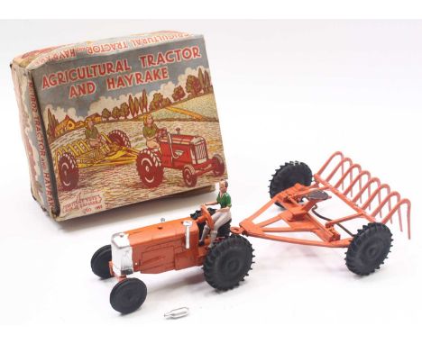 Crescent Toys Agricultural Tractor and Hayrake boxed set, comprising orange rake with black wheels, tractor, in orange with b
