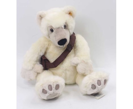 A Steiff soft-filled seated polar bear from The Father &amp; Son Expedition, yellow tag No. 016011, white plush example with 
