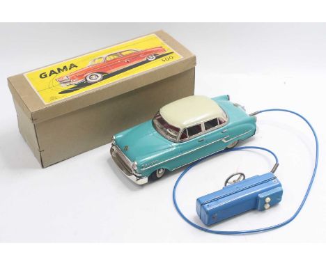 Gama No.400 tinplate and battery-operated model of an Opel Kapitan saloon, comprising turquoise body with cream roof and deta