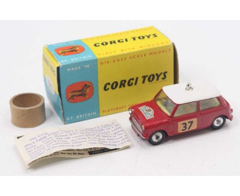 Corgi Toys No.317 B.M.C Mini Cooper with a red body and white roof, fitted with yellow interior, jewel headlights and no.37 d