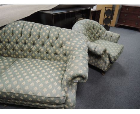 A modern lounge suite of traditional button back design