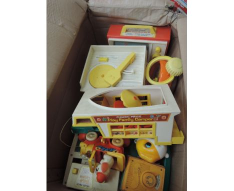 A shelf of 1980's Fisher Price and similar toys including Music Box TV, Music Box record player etc