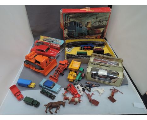 A shelf of mixed toys including a Triang OO gauge RS43 boxed set, an H.K. Plastic and battery operated Jaguar Mark X, a Marx 