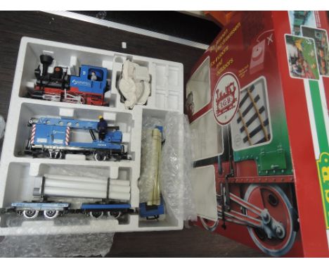 An LGB G scale starter set 78435 comprising 0-4-0 locomotive, two pipe trailers, crane trailer and control unit, boxed