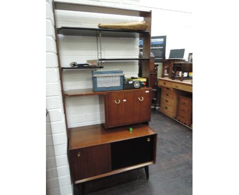 A 1960s mahogany open shelf lounge unit