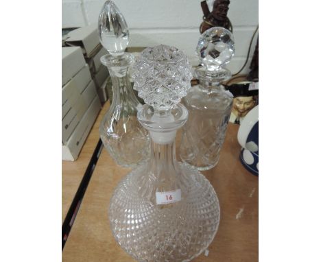 Three decanters including Edinburgh Crystal and ships decanter