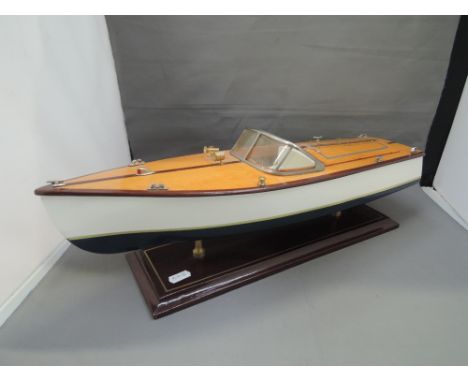 A modern model cruise boat on display plinth