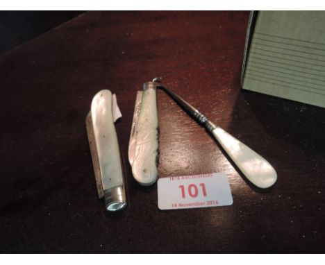 Two HM bladed mother of pearl handled fruit knives and mother of pearl handled button hook