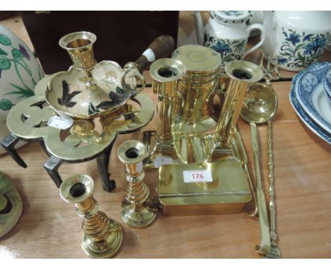 A selection of brassware including cigarette box, candlesticks, toasting fork and ladles etc