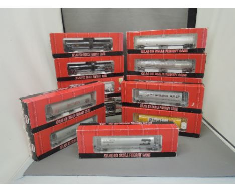 Thirteen Atlas HO Scale cylindrical hopper and tank cars, all boxed