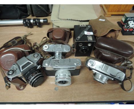 A selection of vintage cameras including Halina super, Ilford Sportsman auto RF and a Thagee (dresden) Exa 2 with light meter