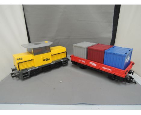 A Playmobil G scale PM cargo locomotive and trailer set, boxed