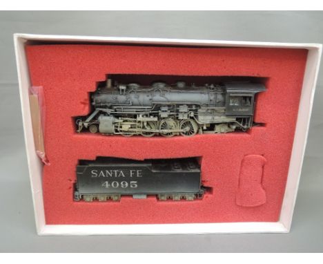 A Sunset model, HO Scale, Santa Fe 2-8-2 locomotive and tender numbered 4095, boxed, 4000 class