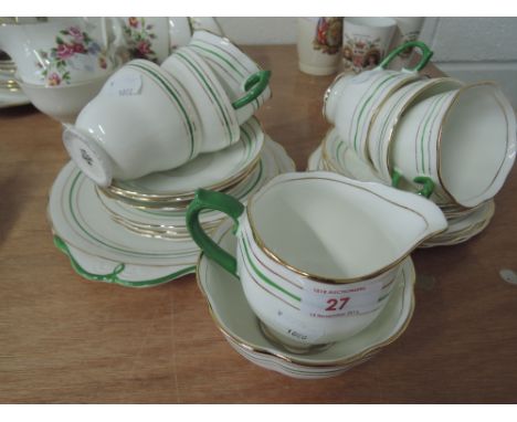 A part Royal Albert tea service green handle with gilt and green rings