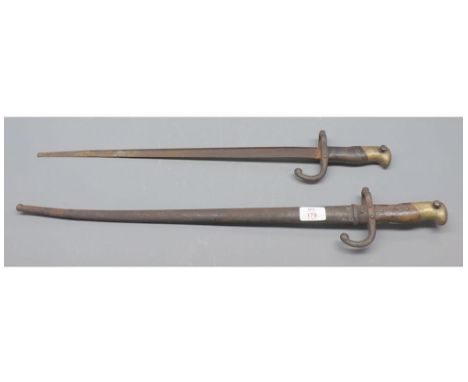 Two 19th century bayonets, one with scabbard, unsigned, largest approx 25" long 