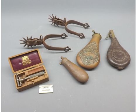 Mixed Lot: vintage powder flasks, iron riding spur and a boxed Wilkinson's razor 