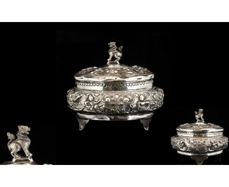 Burmese Silver Antique Trinket Box. Planished 19th century silver trinket box of circler form, decorated throughout with Berm